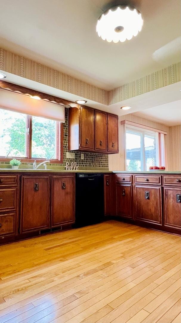 1305 Baugh Dr, Normal, IL 61761 - kitchen with dishwasher, light wood-type flooring, plenty of natural light, and a sink