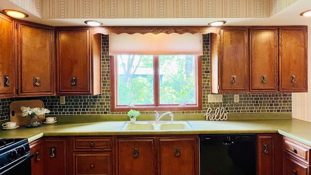 1305 Baugh Dr, Normal, IL 61761 - kitchen with black appliances, a sink, brown cabinets, and light countertops