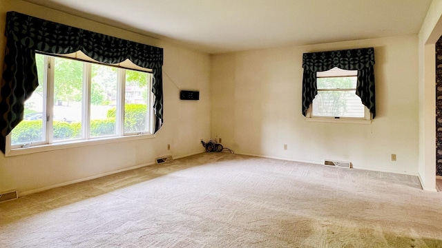 1305 Baugh Dr, Normal, IL 61761 - carpeted empty room featuring plenty of natural light and baseboards