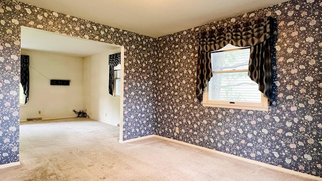 1305 Baugh Dr, Normal, IL 61761 - spare room featuring carpet flooring, baseboards, and wallpapered walls