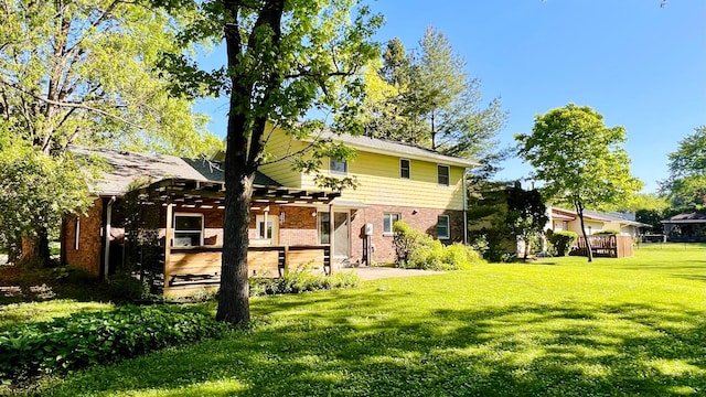 1305 Baugh Dr, Normal, IL 61761 - back of property featuring a lawn and brick siding