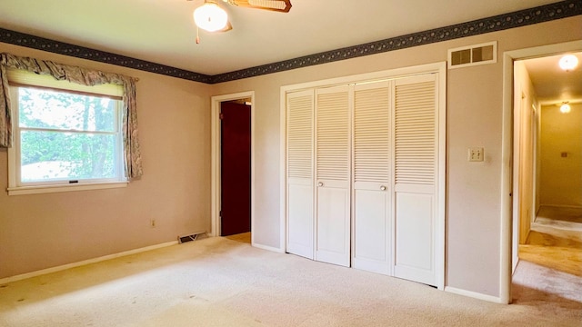 1305 Baugh Dr, Normal, IL 61761 - unfurnished bedroom featuring carpet, a closet, baseboards, and a ceiling fan