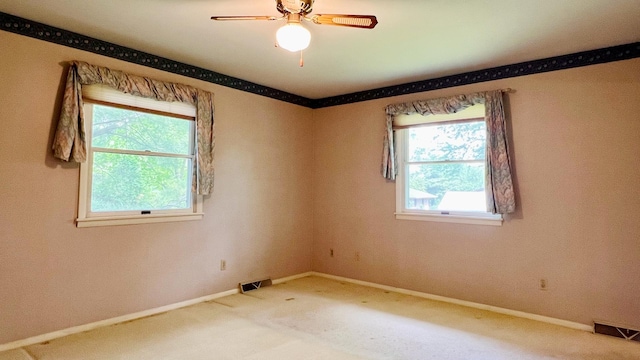1305 Baugh Dr, Normal, IL 61761 - spare room with carpet, baseboards, and a ceiling fan