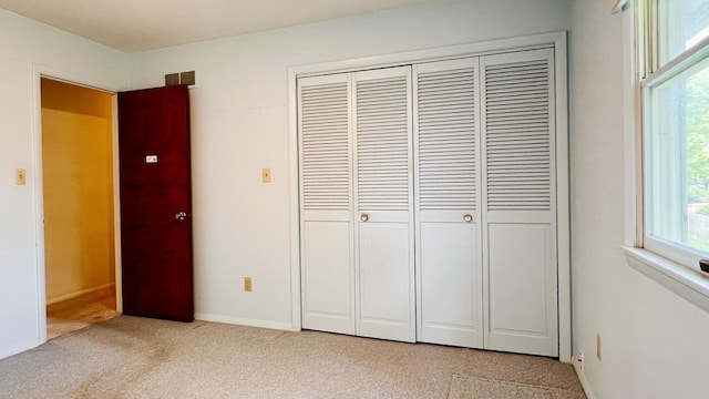 1305 Baugh Dr, Normal, IL 61761 - unfurnished bedroom with a closet and light colored carpet