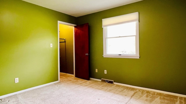 1305 Baugh Dr, Normal, IL 61761 - unfurnished bedroom with carpet flooring and baseboards