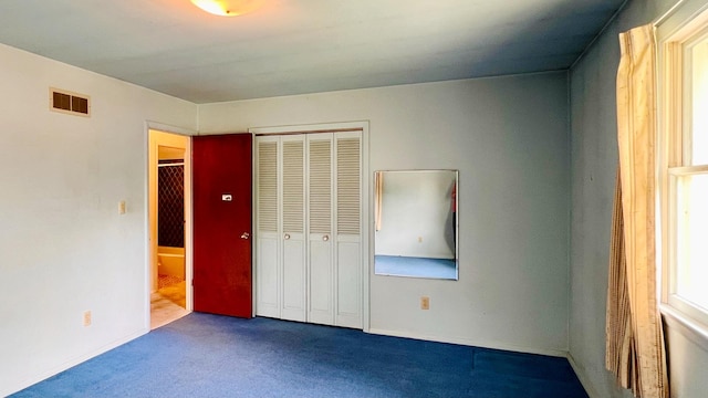 1305 Baugh Dr, Normal, IL 61761 - unfurnished bedroom with carpet floors and a closet