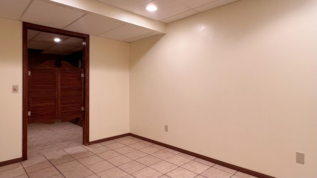 1305 Baugh Dr, Normal, IL 61761 - empty room featuring light tile patterned floors, a paneled ceiling, baseboards, and recessed lighting