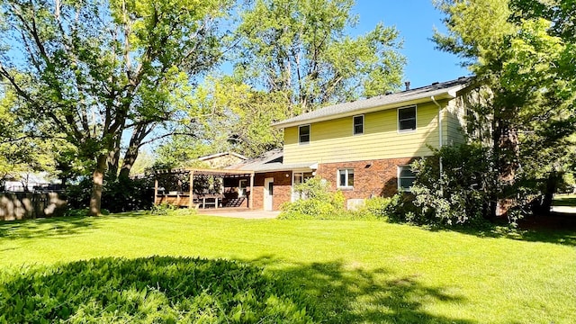 1305 Baugh Dr, Normal, IL 61761 - rear view of property featuring brick siding and a patio area