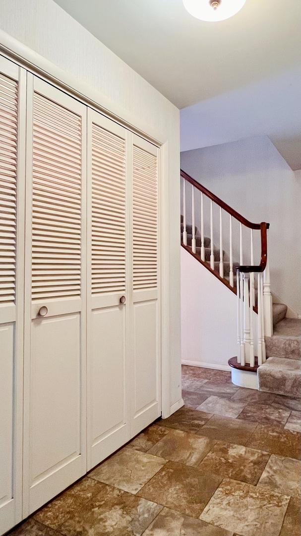 1305 Baugh Dr, Normal, IL 61761 - corridor with stone finish flooring and stairway