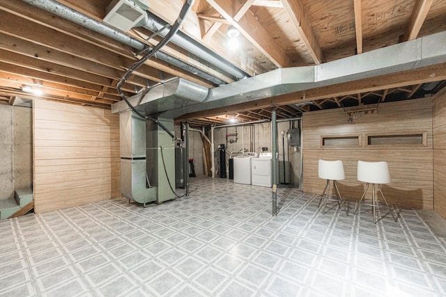 1868 Kerrybrook Ct Unit 1868, Sycamore, IL 60178 - unfinished below grade area featuring independent washer and dryer, wooden walls, heating unit, and tile patterned floors