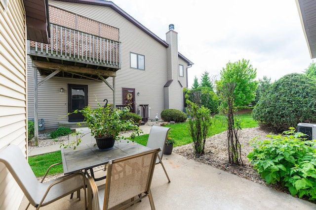 1868 Kerrybrook Ct Unit 1868, Sycamore, IL 60178 - view of patio featuring outdoor dining space, a balcony, and central air condition unit