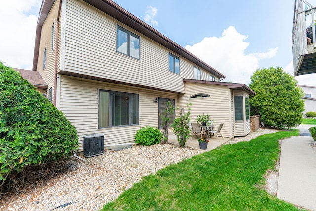 1868 Kerrybrook Ct Unit 1868, Sycamore, IL 60178 - rear view of property with a patio, central AC unit, and a yard