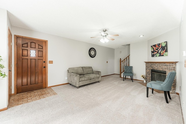1868 Kerrybrook Ct Unit 1868, Sycamore, IL 60178 - living area featuring light colored carpet, ceiling fan, stairs, baseboards, and a brick fireplace