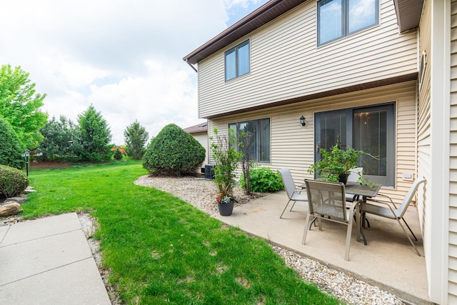 1868 Kerrybrook Ct Unit 1868, Sycamore, IL 60178 - view of green lawn featuring a patio area and central AC