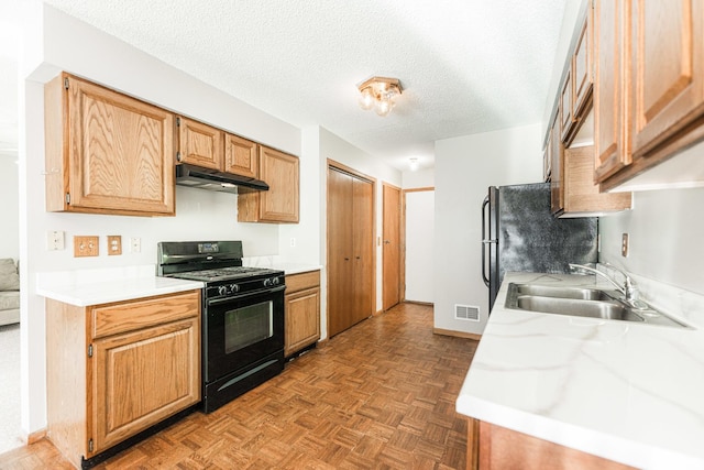 1868 Kerrybrook Ct Unit 1868, Sycamore, IL 60178 - kitchen with black appliances, a sink, light countertops, under cabinet range hood, and a textured ceiling