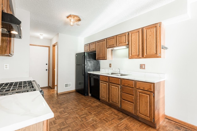 1868 Kerrybrook Ct Unit 1868, Sycamore, IL 60178 - kitchen with a sink, black appliances, range hood, light countertops, and a textured ceiling