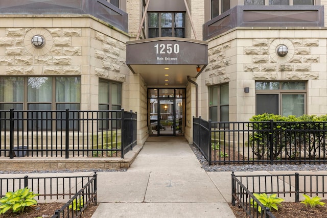 view of exterior entry featuring stone siding