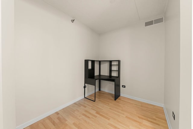 unfurnished bedroom with light wood-style floors and baseboards
