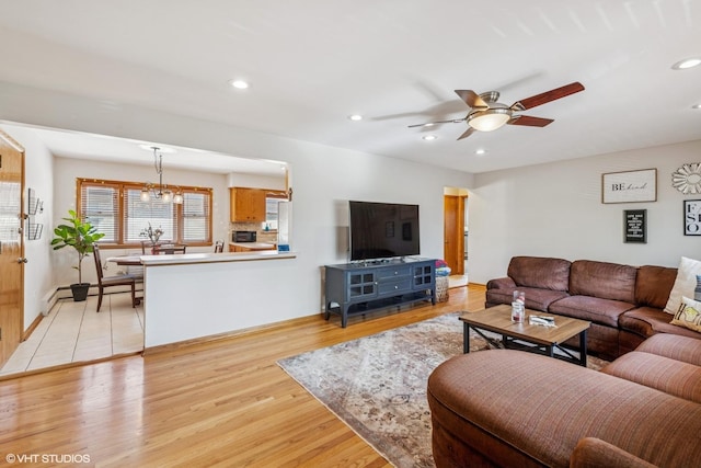 6810 N Ozark Ave Unit 9, Chicago, IL 60631 - living area featuring light wood-style floors, a ceiling fan, recessed lighting, and baseboards