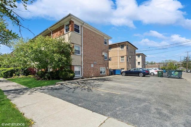 6810 N Ozark Ave Unit 9, Chicago, IL 60631 - view of building exterior featuring uncovered parking