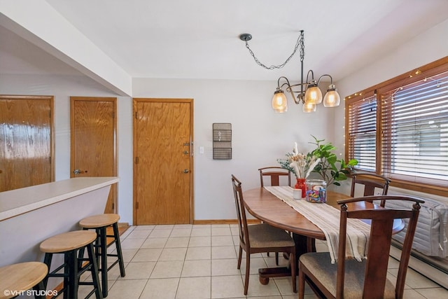 6810 N Ozark Ave Unit 9, Chicago, IL 60631 - dining area featuring light tile patterned floors and a baseboard heating unit