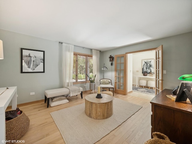 14705 Pleasant Valley Rd, Woodstock, IL 60098 - living room with light wood finished floors, french doors, an office area, and baseboards