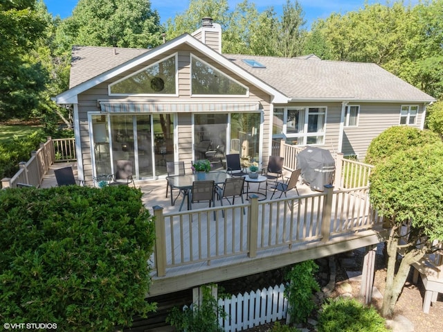14705 Pleasant Valley Rd, Woodstock, IL 60098 - back of property featuring a deck, a chimney, a shingled roof, and outdoor dining area