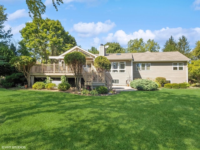 14705 Pleasant Valley Rd, Woodstock, IL 60098 - rear view of house with a chimney, a wooden deck, and a yard