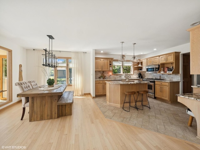 14705 Pleasant Valley Rd, Woodstock, IL 60098 - kitchen featuring stainless steel appliances, open shelves, a center island, decorative backsplash, and light stone counters