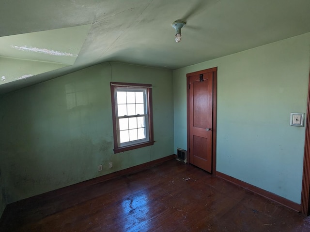 7317 S Mozart St, Chicago, IL 60629 - bonus room featuring lofted ceiling, wood finished floors, and baseboards