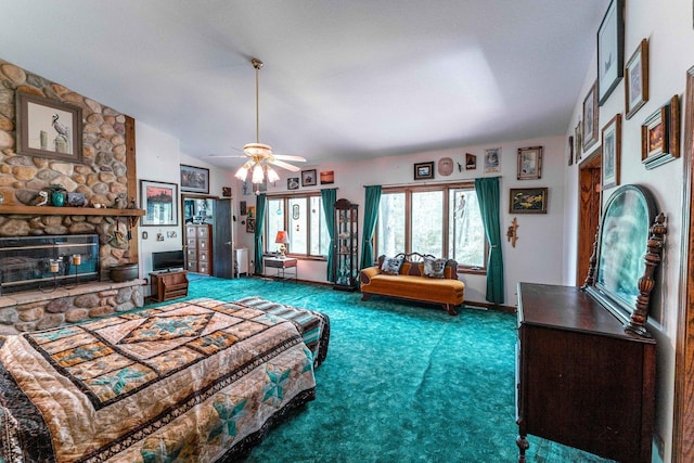 1479 Old Mill Rd, Franklin Grove, IL 61031 - carpeted living room featuring a fireplace, a ceiling fan, and vaulted ceiling