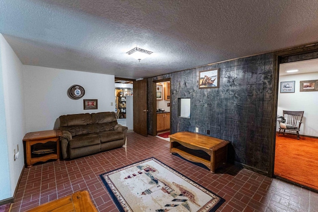 1479 Old Mill Rd, Franklin Grove, IL 61031 - living area featuring brick patterned floors, wood walls, and baseboards