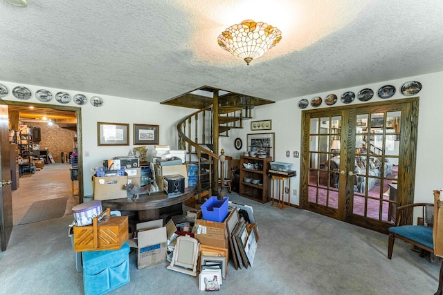 1479 Old Mill Rd, Franklin Grove, IL 61031 - dining area with french doors, a textured ceiling, carpet flooring, and stairway