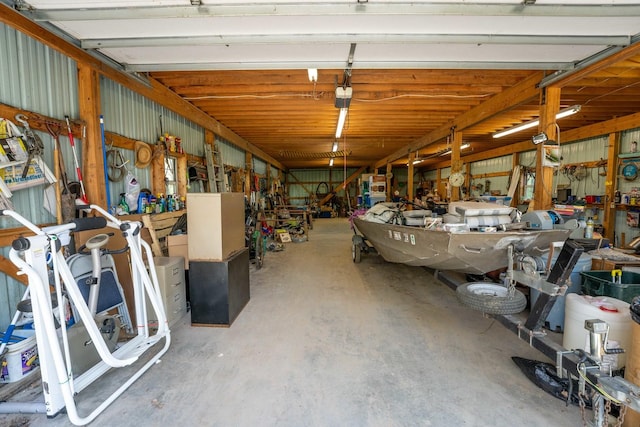 1479 Old Mill Rd, Franklin Grove, IL 61031 - garage featuring a workshop area and a garage door opener