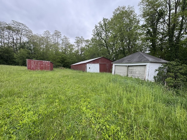 1479 Old Mill Rd, Franklin Grove, IL 61031 - view of yard with a detached garage and an outbuilding