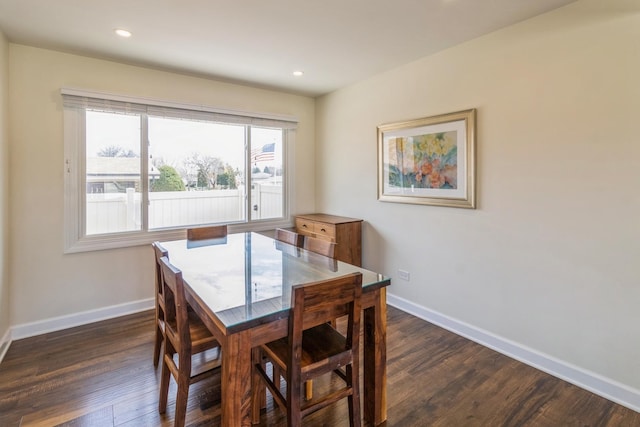 dining area featuring baseboards, dark wood-type flooring, and recessed lighting