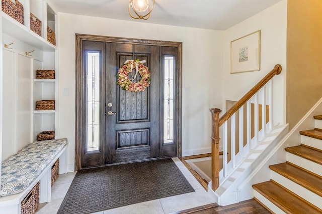 tiled foyer with stairway