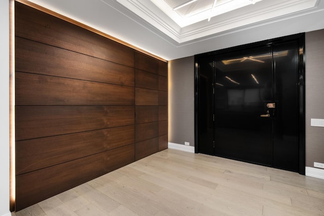 entryway featuring light wood finished floors and baseboards