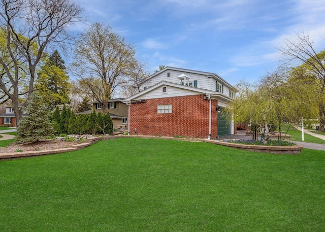 view of home's exterior with brick siding and a yard
