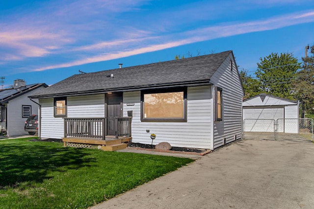 2825 S 13th Ave, Broadview, IL 60155 - bungalow-style house featuring a yard, a shingled roof, a garage, and an outbuilding