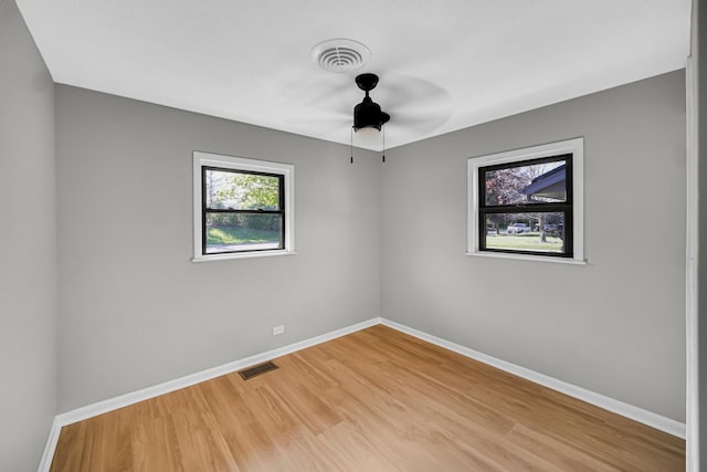 2825 S 13th Ave, Broadview, IL 60155 - spare room featuring baseboards, light wood-type flooring, and a ceiling fan
