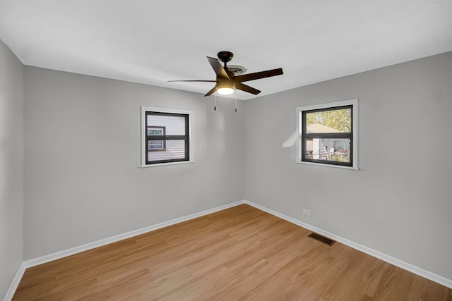2825 S 13th Ave, Broadview, IL 60155 - empty room featuring plenty of natural light, light wood finished floors, and baseboards