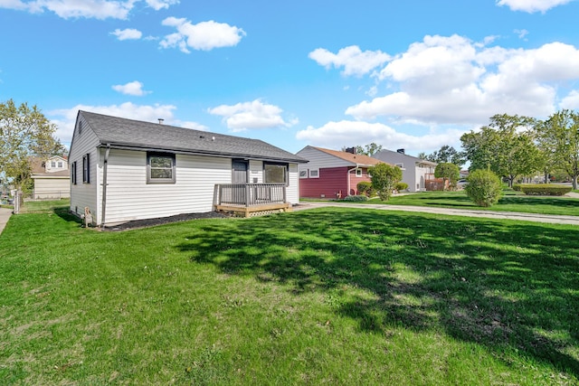 2825 S 13th Ave, Broadview, IL 60155 - view of front of home with a front lawn, a deck, and roof with shingles