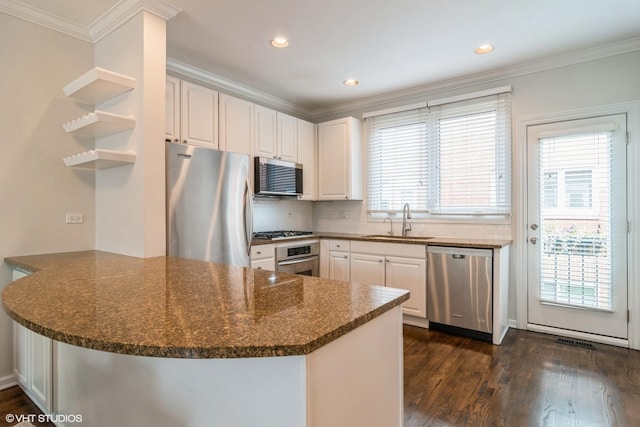 1835 W Oakdale Ave Unit E, Chicago, IL 60657 - kitchen with appliances with stainless steel finishes, open shelves, a peninsula, a sink, and dark wood-type flooring