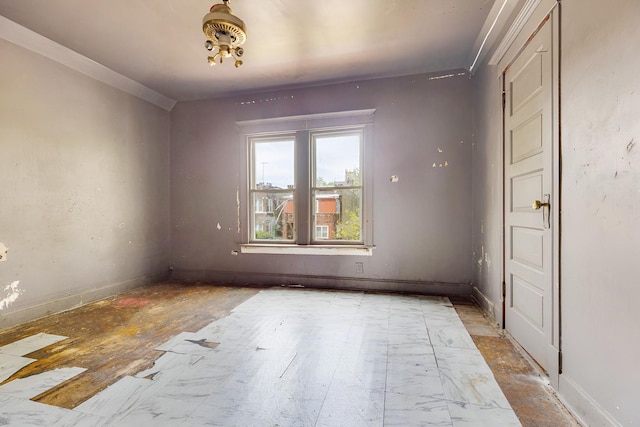 7813 S May St, Chicago, IL 60620 - spare room with baseboards and crown molding