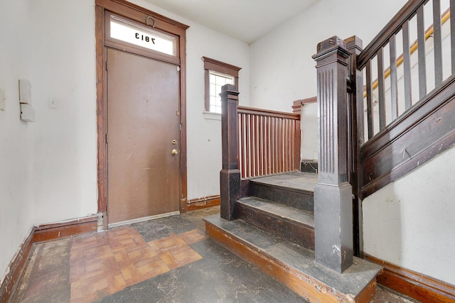 7813 S May St, Chicago, IL 60620 - foyer entrance with stairs, stone finish flooring, and baseboards