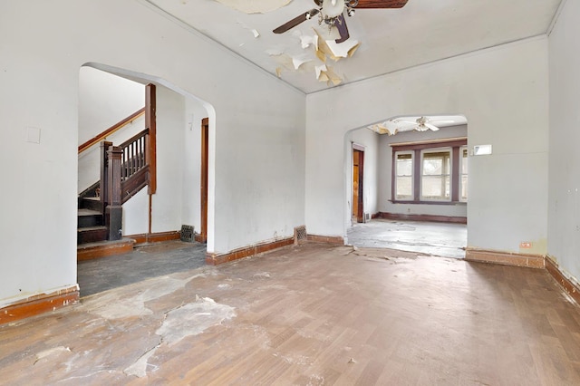 7813 S May St, Chicago, IL 60620 - unfurnished room featuring ceiling fan, arched walkways, stairs, and baseboards