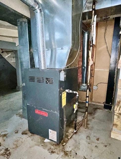 utility room with heating unit