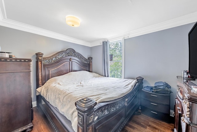 bedroom featuring ornamental molding, dark wood-type flooring, and baseboards