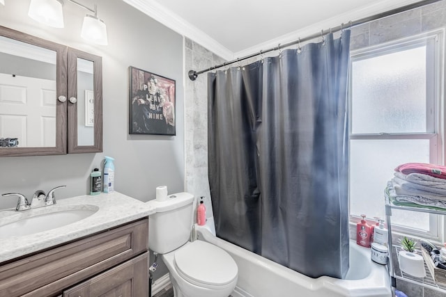 full bathroom featuring shower / bath combo with shower curtain, vanity, toilet, and crown molding
